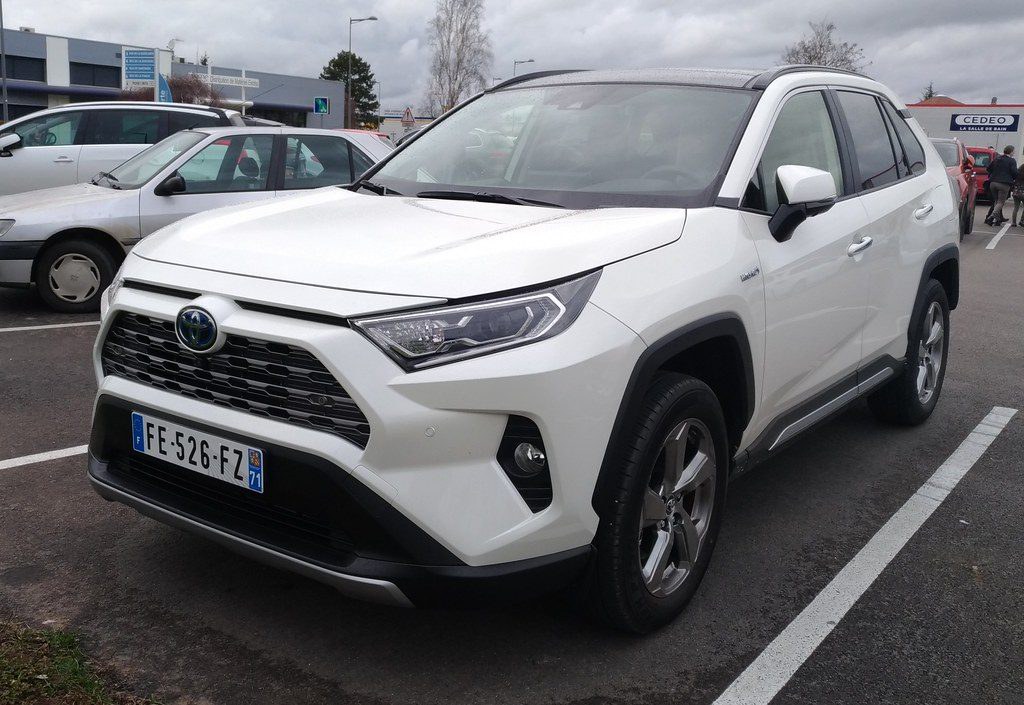 Front three-quarter view of a white 2020 Toyota RAV4 Hybrid