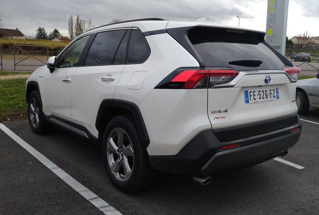 Rear view of the white Toyota RAV4 Hybrid